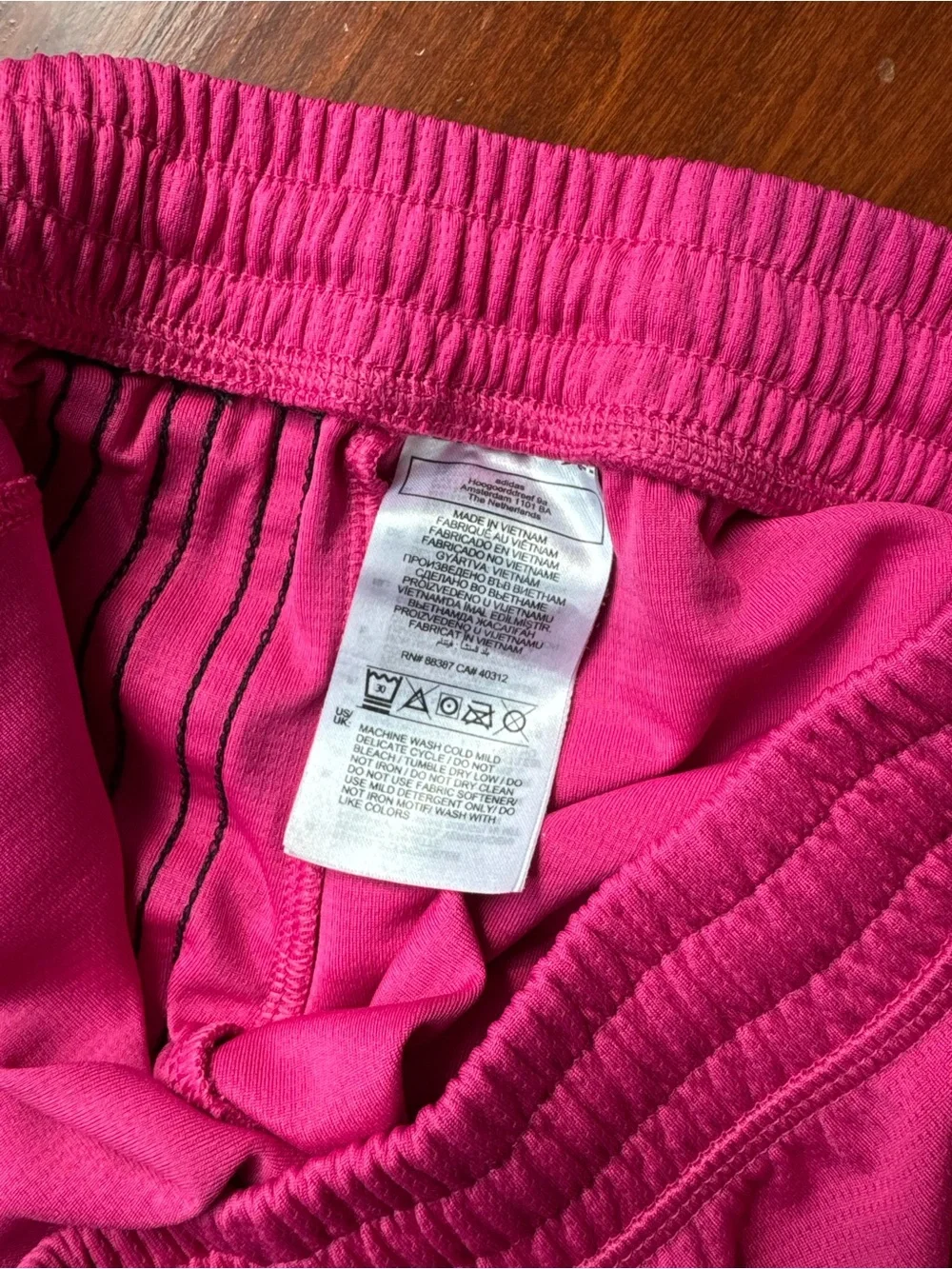 Adidas Women’s Pink Athletic Shorts with Black Stripes